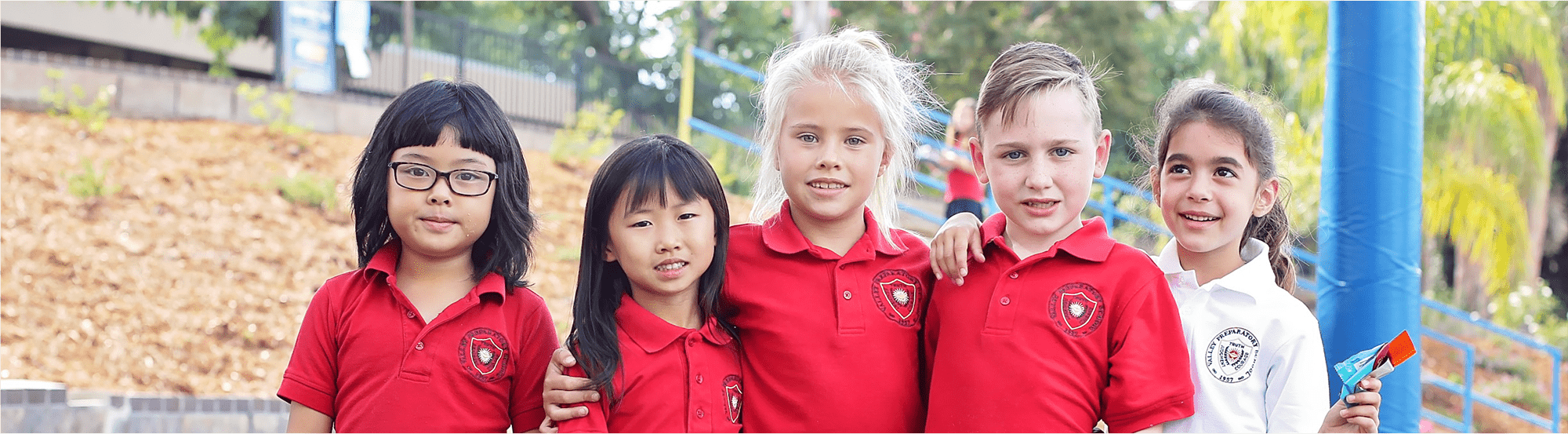 Students pose together outside