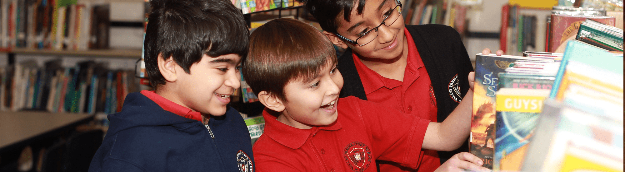 Male students look at library books