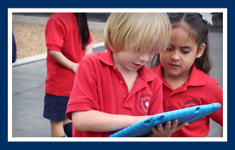 Students use tablets outside